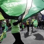 Members of the Sanford High School color guard of Sanford, Me., twirled flags while marching in last year’s St. Patrick's Day Parade.   (AP File Photo/Steven Senne)